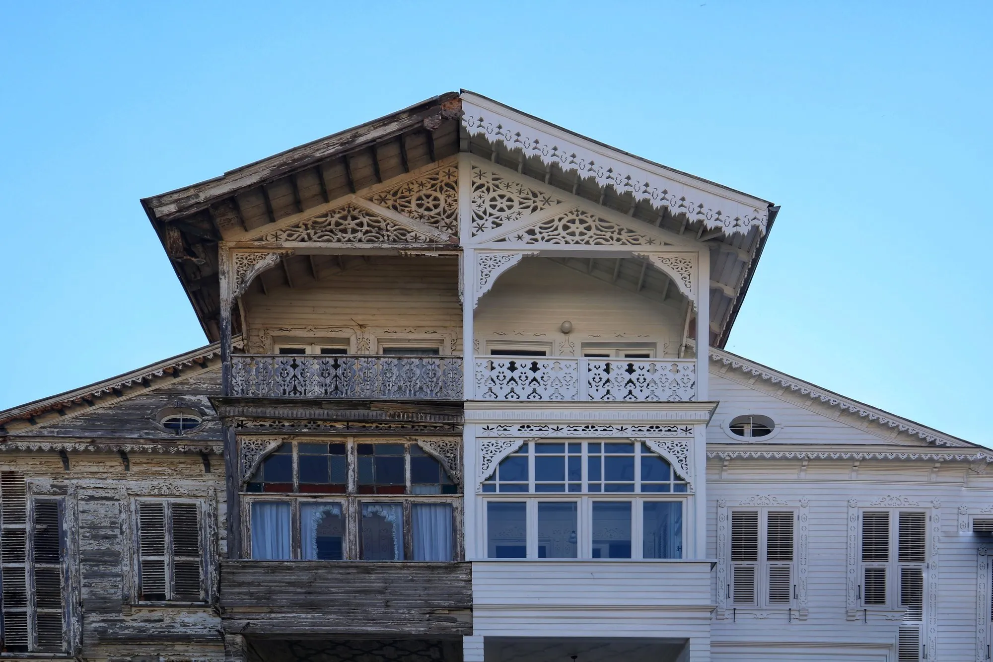 Half-renovated house facade showing old versus new