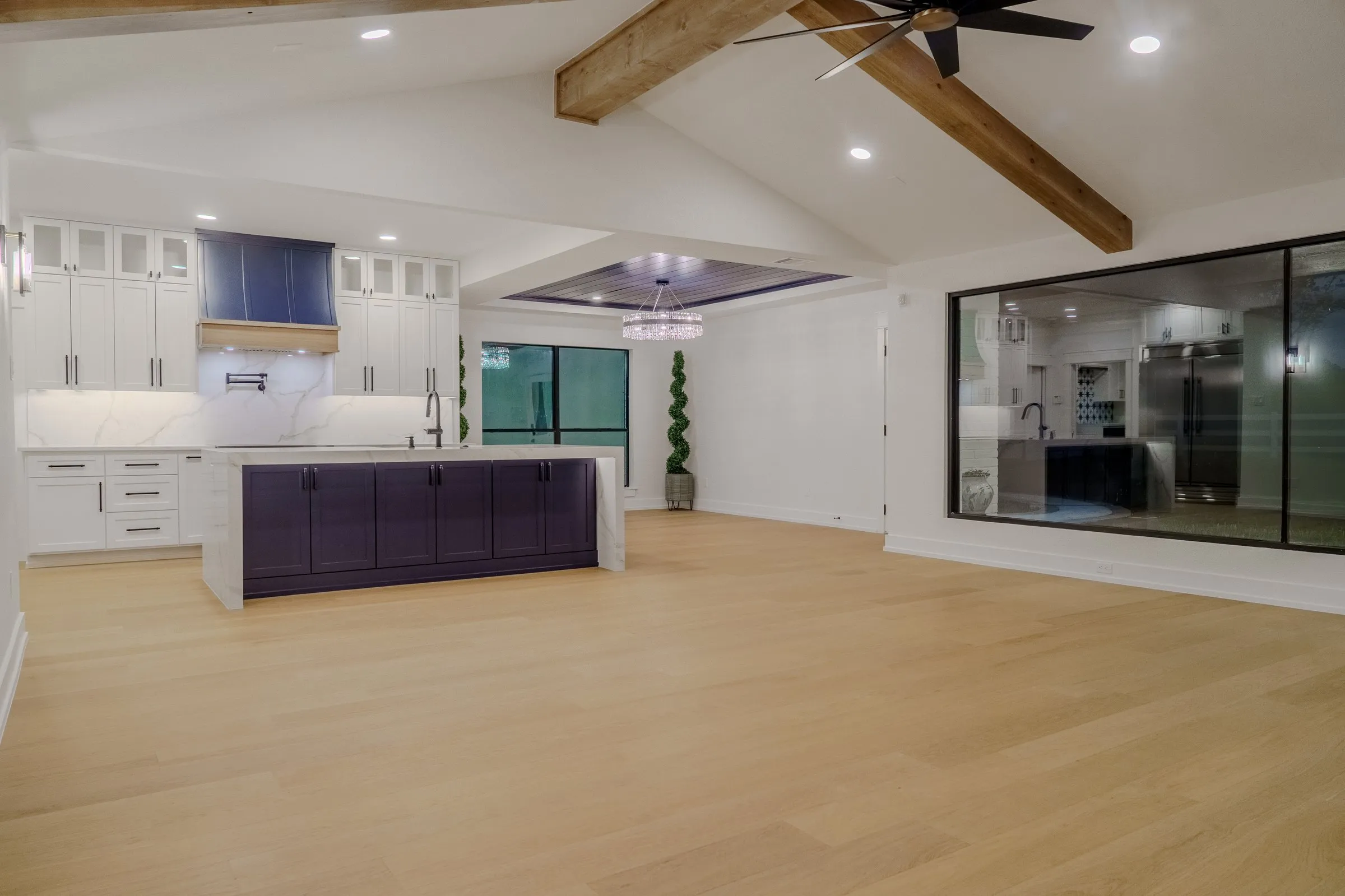 Finished kitchen renovation with vaulted wood-beam ceiling