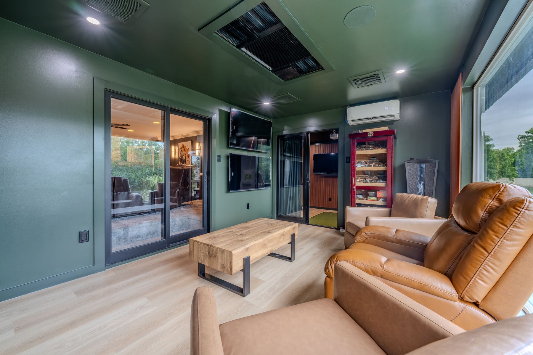 Lounge with leather seating and cigar cabinet